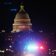 A police car drives away from the Capital after thousands of Donald Trump supporters stormed the United States Capitol building following a “Stop the Steal” rally on January 06, 2021 in Washington, D.C.